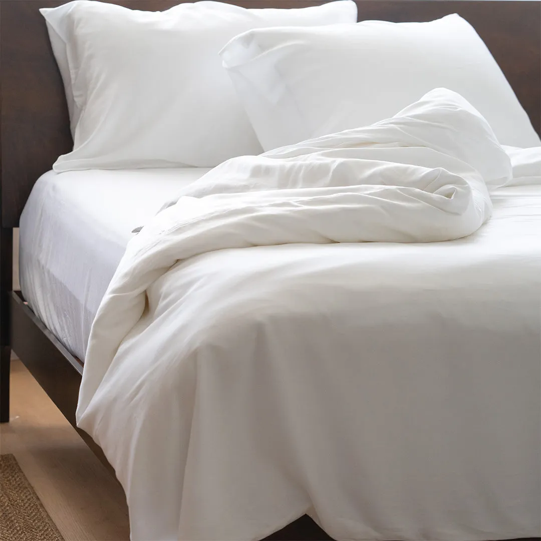 White duvet folded on bed